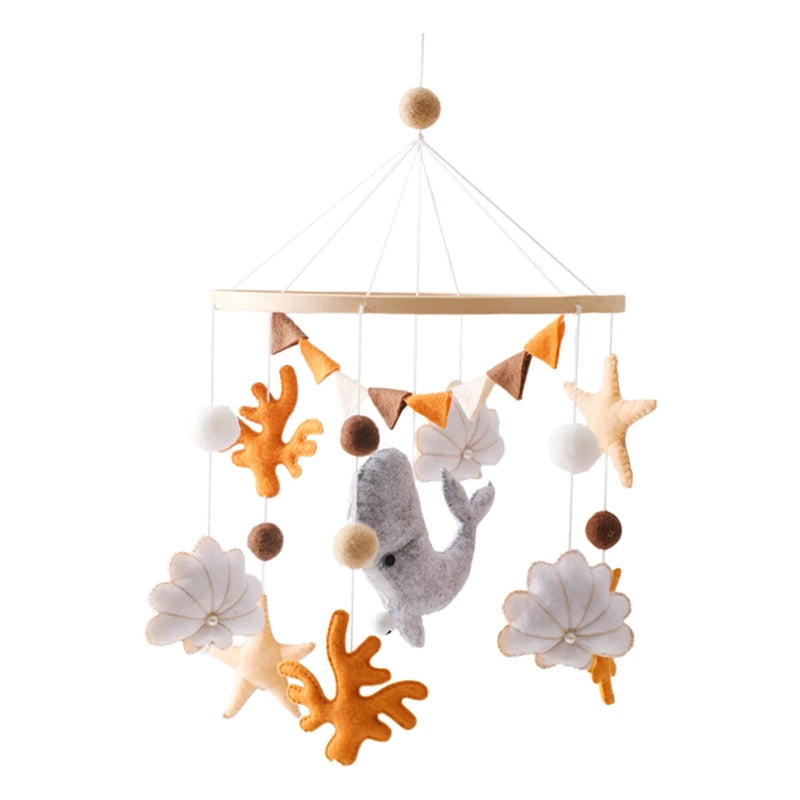 Nautical-themed baby mobile with fish, starfish, and coral on a white background