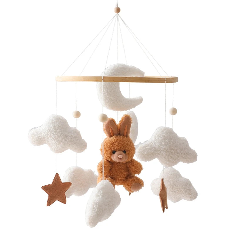 Baby mobile with plush bunny and clouds on a white background