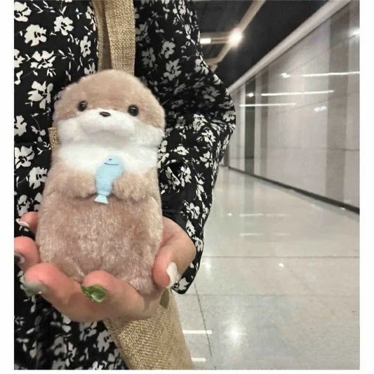 Fall in love with the Japanese Otter Plush hugging a tiny fish! Ultra-soft, kawaii, and perfect for kids or collectors. 🐾 Get yours today!