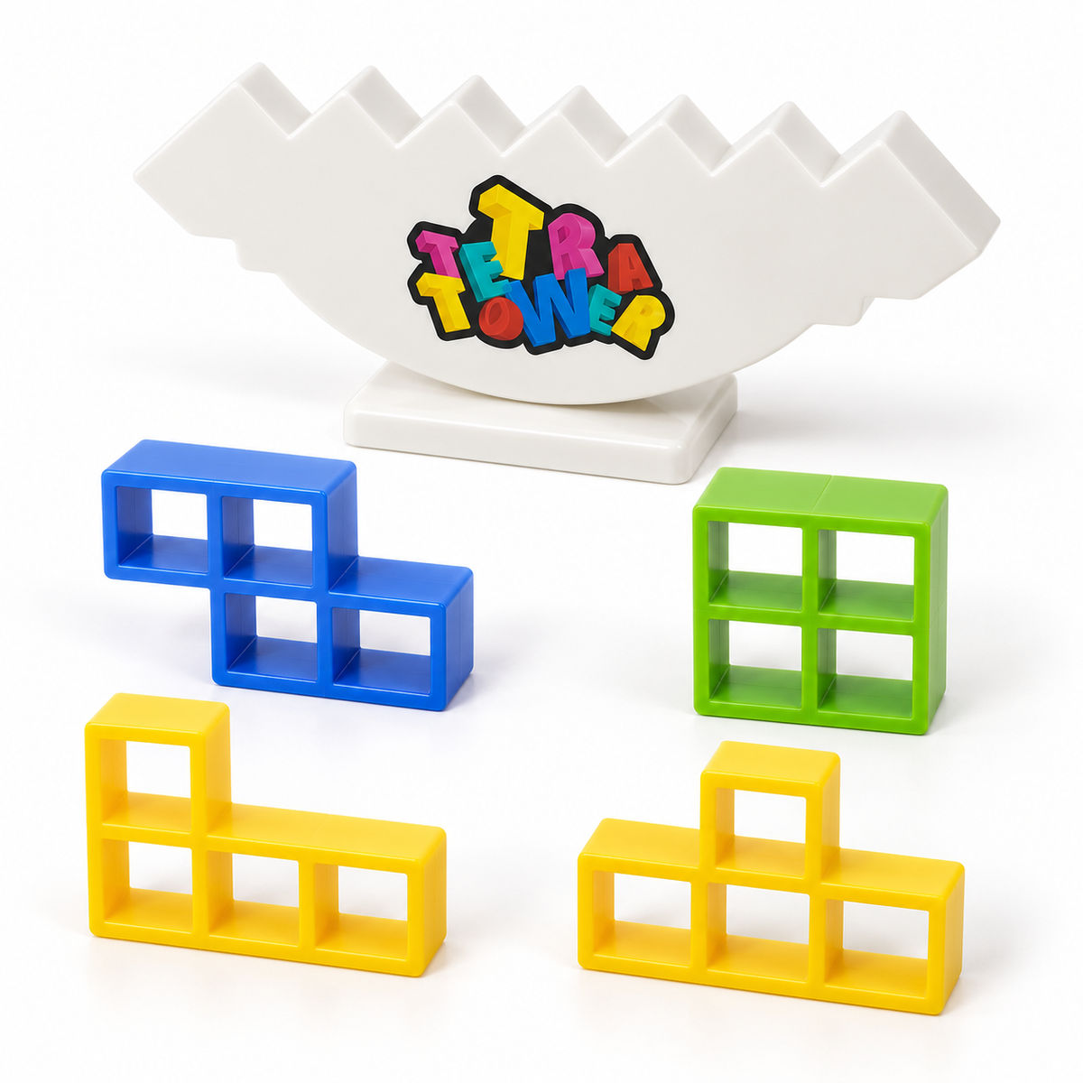 Blue, green and yellow hollow stacking pieces beside the white Tetra Tower balancing base.