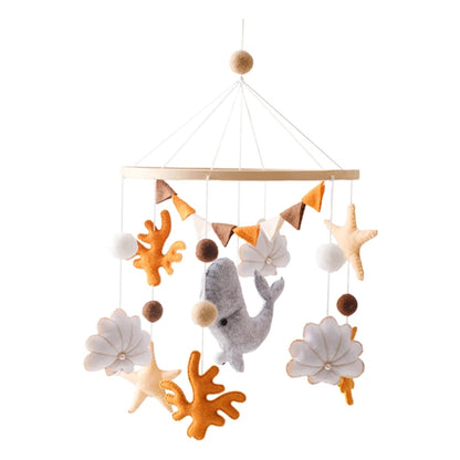 Nautical-themed baby mobile with fish, starfish, and coral on a white background