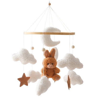 Baby mobile with plush bunny and clouds on a white background
