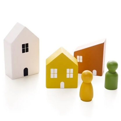 Colorful wooden house models and figures on a white background - house 1