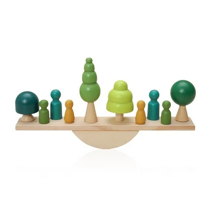 Wooden balance toy with colorful figures and trees on a white treebackground