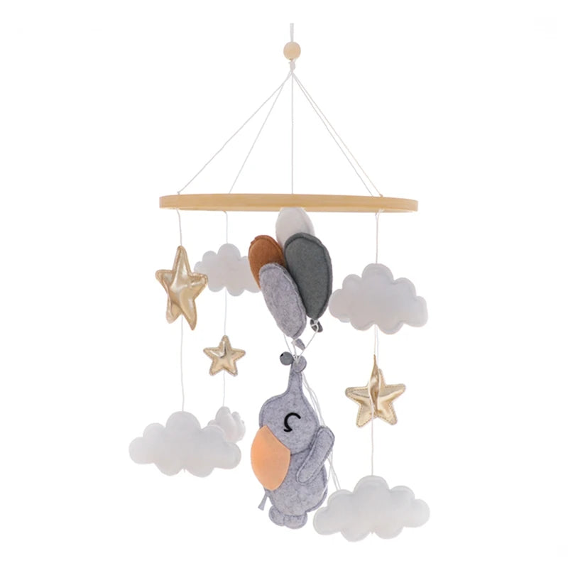 Baby mobile with elephant, stars, and clouds on a white background