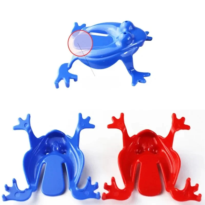 Blue and red plastic frog-shaped objects on a white background