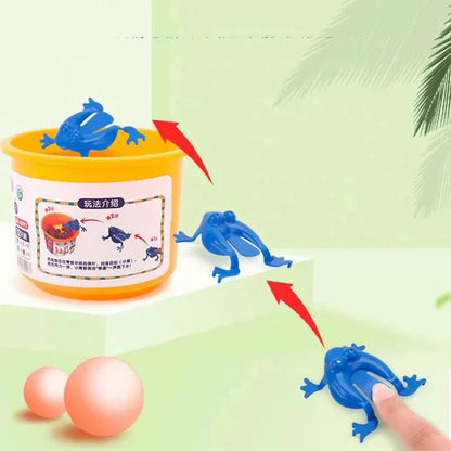 Toy frog with a container and ball on a green background