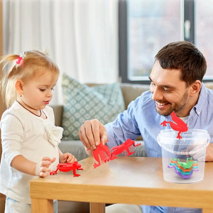 Man and child playing with colorful toy dinosaurs on a table in a living room.
