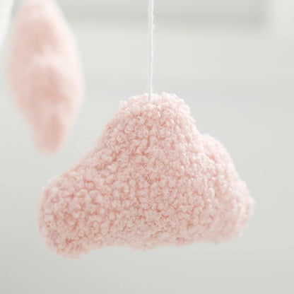 Pink cloud-shaped decorative item on a white background
