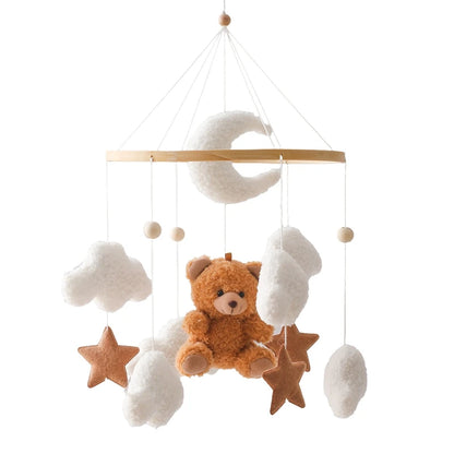 Baby mobile with teddy bear, stars, and clouds on a white background