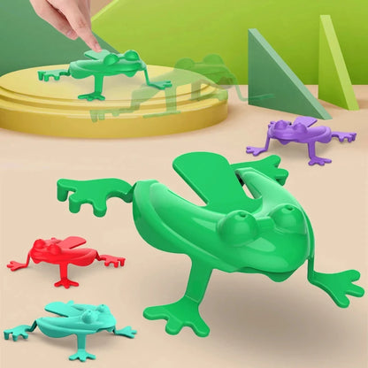 Colorful plastic frogs on a green and beige surface