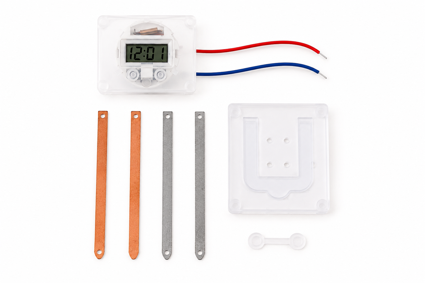 Close-up of the Potato Battery Clock Science Kit with digital clock, wires, metal electrodes and clear holder.