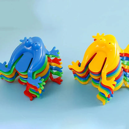 Colorful plastic toys shaped like dragons on a light blue background