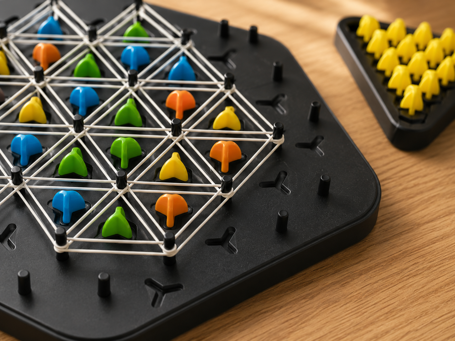 Close-up of the TriLogic™ Strategy Board Game highlighting premium materials, precision elastic bands, colourful playing pieces and detailed craftsmanship.